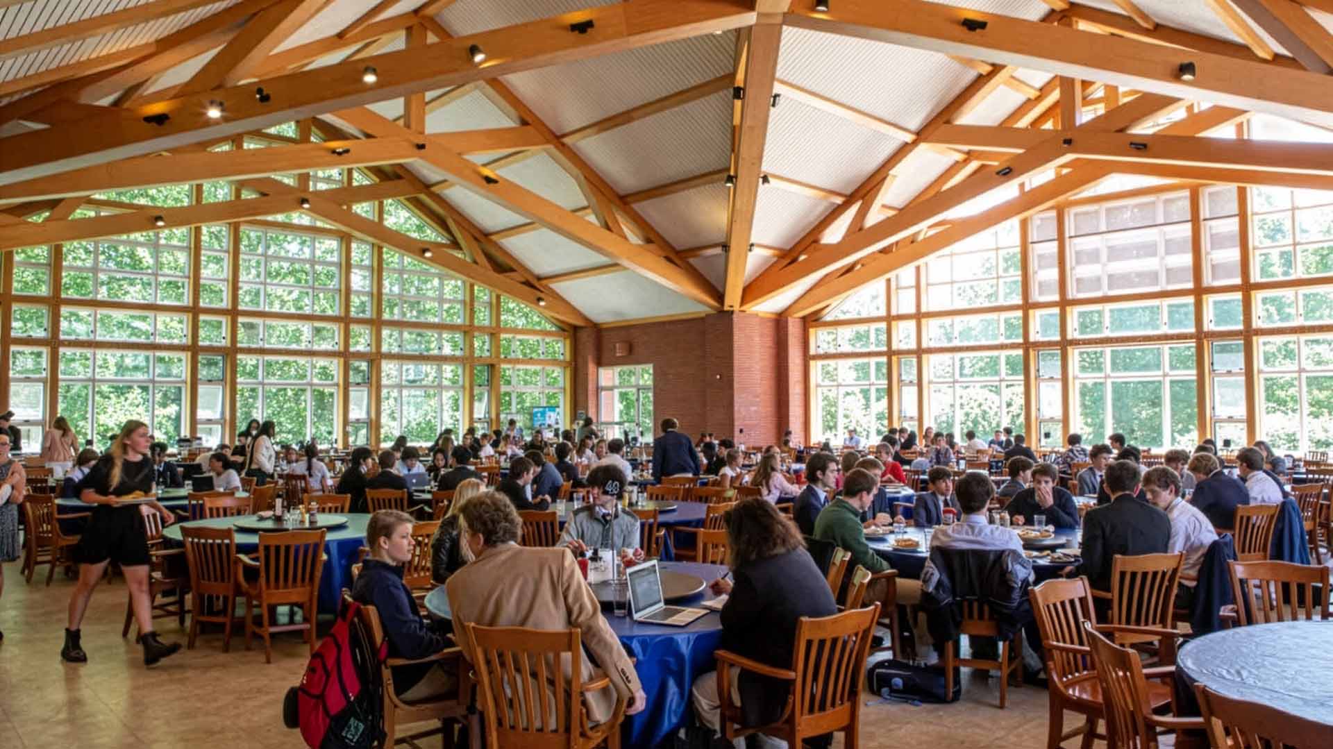Students sitting at tables in Sharp Dining Hall
